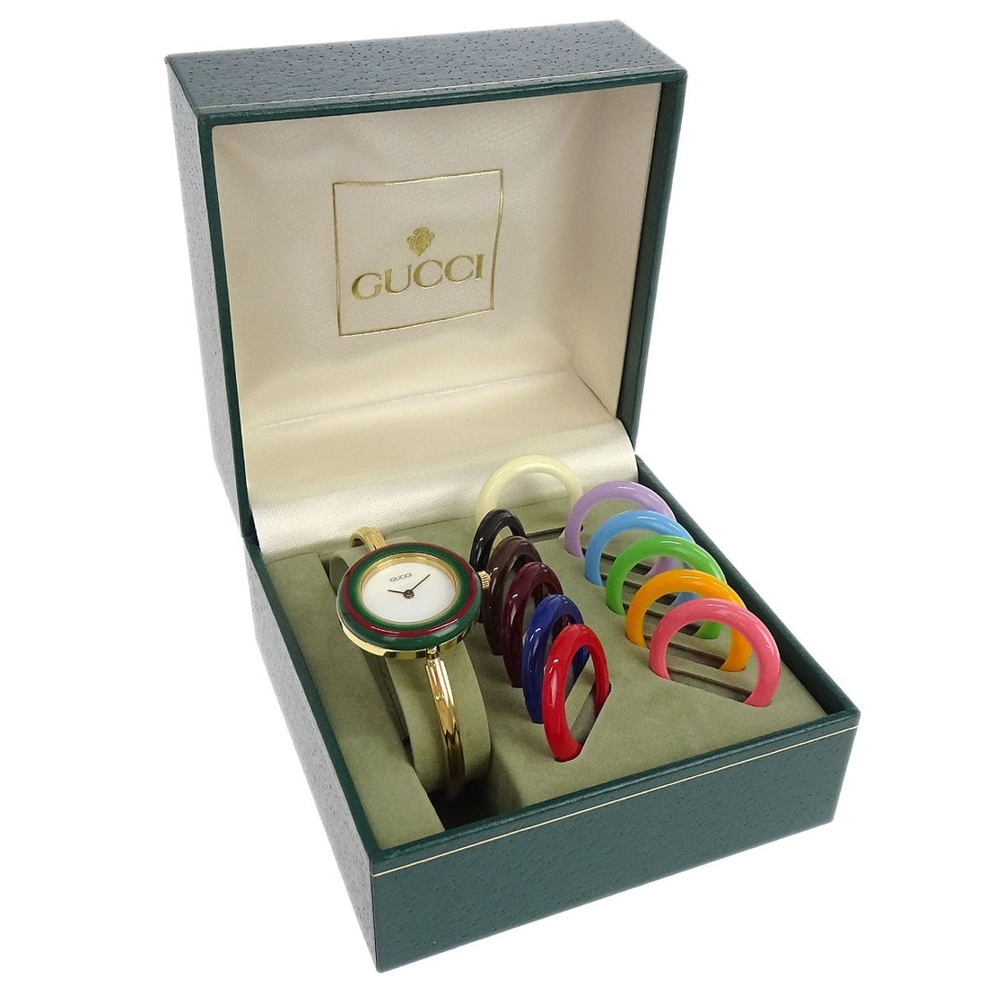 Gucci Change Bezel Chameleon 11 12.2 Swiss Quartz Wristwatch: Gucci Change Bezel Chameleon 11 12.2 Swiss Quartz Wristwatch Gucci 11/12.2 Change Bezel Chameleon quartz wristwatch with a round stainless steel case, white analog dial, and gold-tone stainless steel 