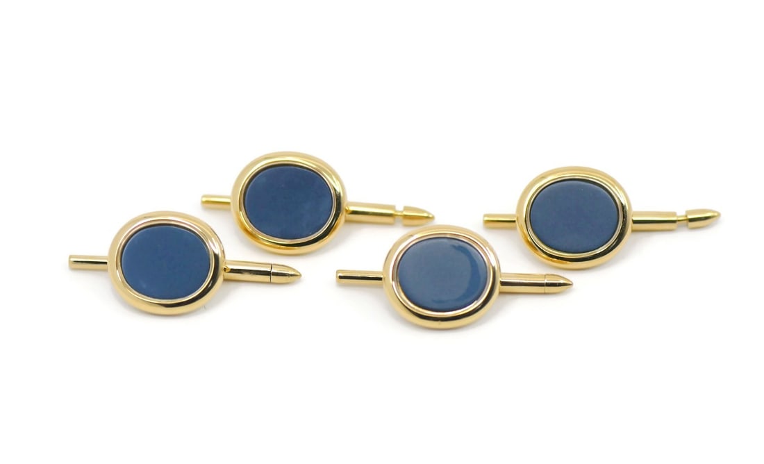 Ellipse Tuxedo Studs in 18K Yellow Gold by Patek Philippe: Ellipse Tuxedo Studs in 18K Yellow Gold by Patek Philippe These Patek Philippe Ellipse tuxedo studs are crafted from 18K yellow gold and designed for men. Made in Switzerland, these pre-owned studs of