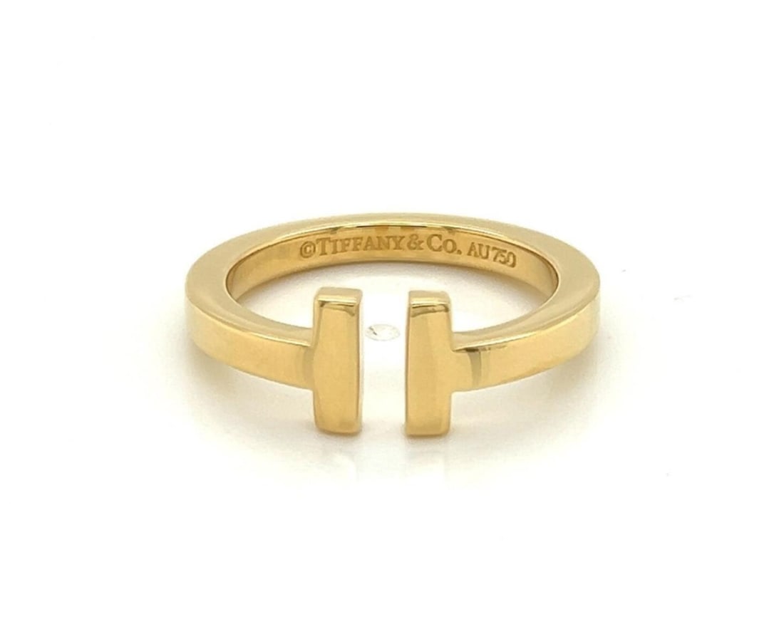 Tiffany & Co. Tiffany T Square 18k Yellow Gold Ring 8.5: Tiffany & Co. Tiffany T Square 18k Yellow Gold Ring 8.5 Tiffany & Co. T Square band ring crafted in 18k yellow gold with a polished finish and the collection's iconic architectural T motif. The ring i