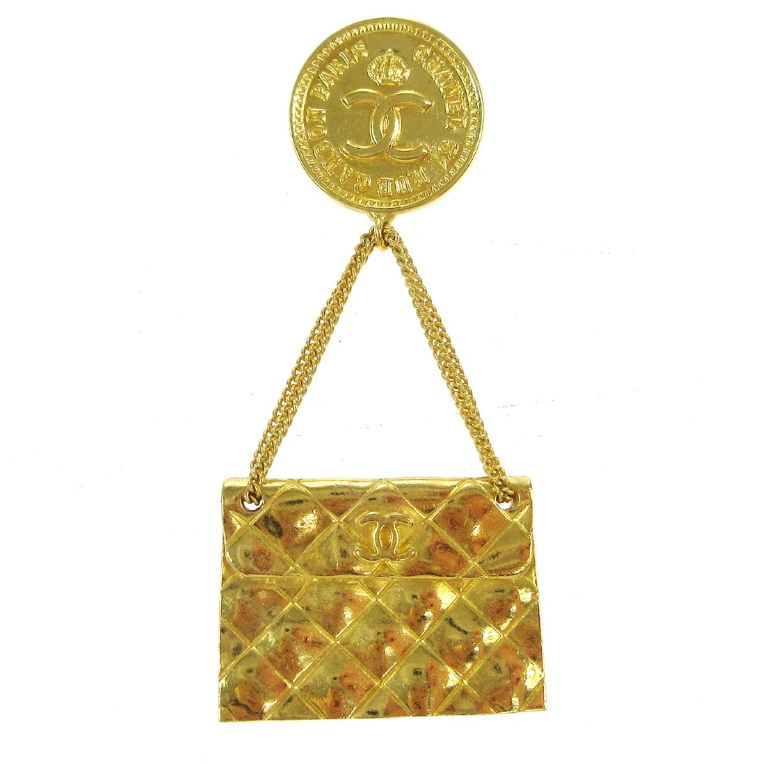 Chanel Gold Tone Bag Motif Brooch Pin with Box: Chanel Gold Tone Bag Motif Brooch Pin with Box Gold-tone Chanel brooch in a handbag motif, marked 93A. Made in France, this pin features a bag-inspired design and comes with a box. Condition shows rea