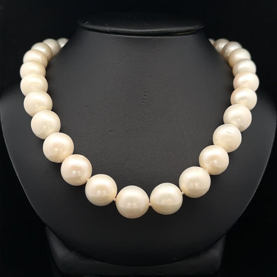 Natural 10-13mm Pearl Necklace 14k White Gold Diamond Clasp: Natural 10-13mm Pearl Necklace 14k White Gold Diamond Clasp This exquisite 19-inch strand necklace features 42 genuine cultured pearls, each round and measuring between 10-13mm. The pearls are strung 