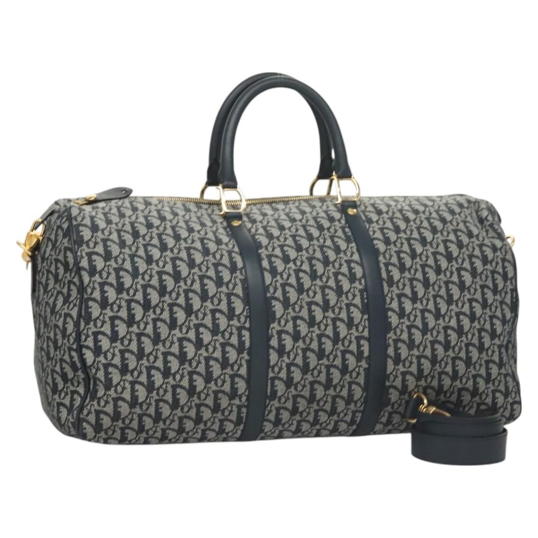 Christian Dior 2way Boston Bag in Navy Gold Trotter Canvas: Christian Dior 2way Boston Bag in Navy Gold Trotter Canvas Christian Dior Trotter Canvas Boston Bag in navy and gold, presented in a 2-way style with a shoulder strap. It comes with a dust bag, padloc