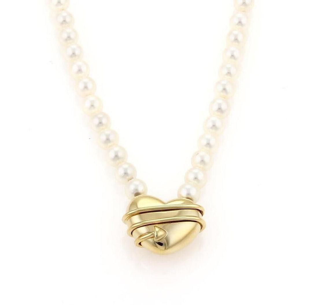 Tiffany & Co. Cupid Arrow Heart Pearl Pendant Necklace 18k Yellow Gold: Tiffany & Co. Cupid Arrow Heart Pearl Pendant Necklace 18k Yellow Gold A pre-owned pendant necklace featuring a Cupid arrow heart motif accented with pearls. Crafted in 18k yellow gold, it has a chain