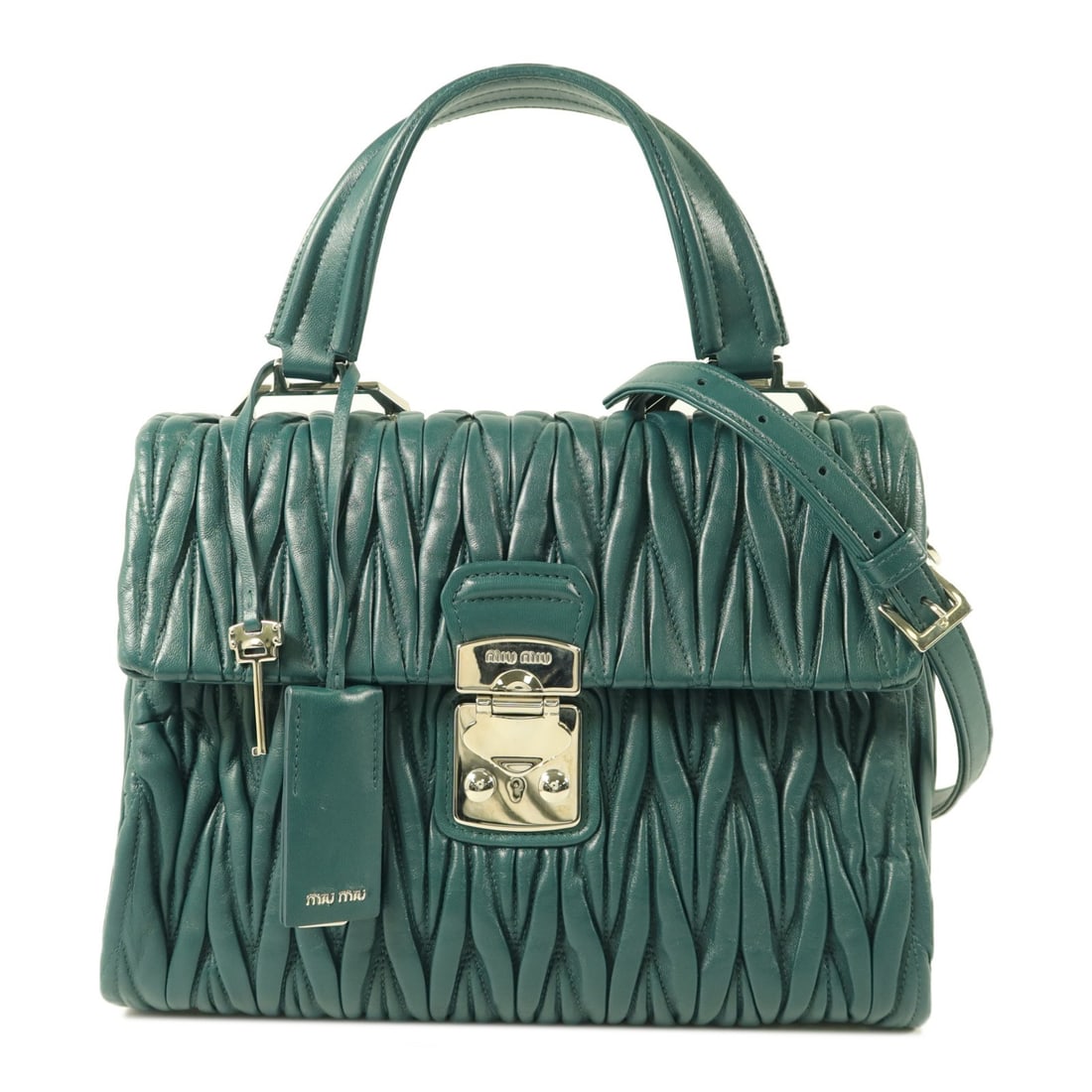 Miu Miu Matelasse Green Calfskin 2 Way Bag 5BA136: Miu Miu Matelasse Green Calfskin 2 Way Bag 5BA136 This Miu Miu 2-way shoulder bag is crafted from calfskin (cowhide) leather in green with a matching green frame color. It features a matelasse design 