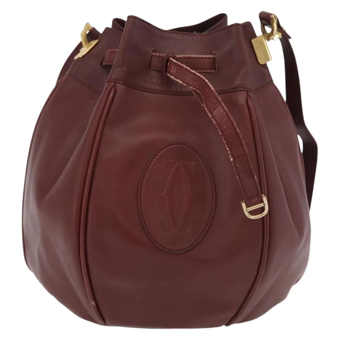 Cartier Must de cartier Burgundy Leather Handbag: Cartier Must de cartier Burgundy Leather Handbag Cartier Must de Cartier leather bag in burgundy. Made in Spain, this piece is presented in fair condition with visible wear, including rubbing, slight 