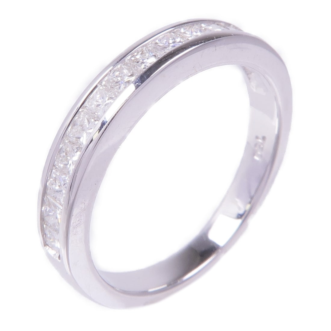 US 5 18K White Gold Diamond Ring by JEWELRY: US 5 18K White Gold Diamond Ring by JEWELRY A women's ring in 18K white gold with diamond accents, presented in clear color. The band features a row of channel-set clear gemstones. It is size US 5, wi