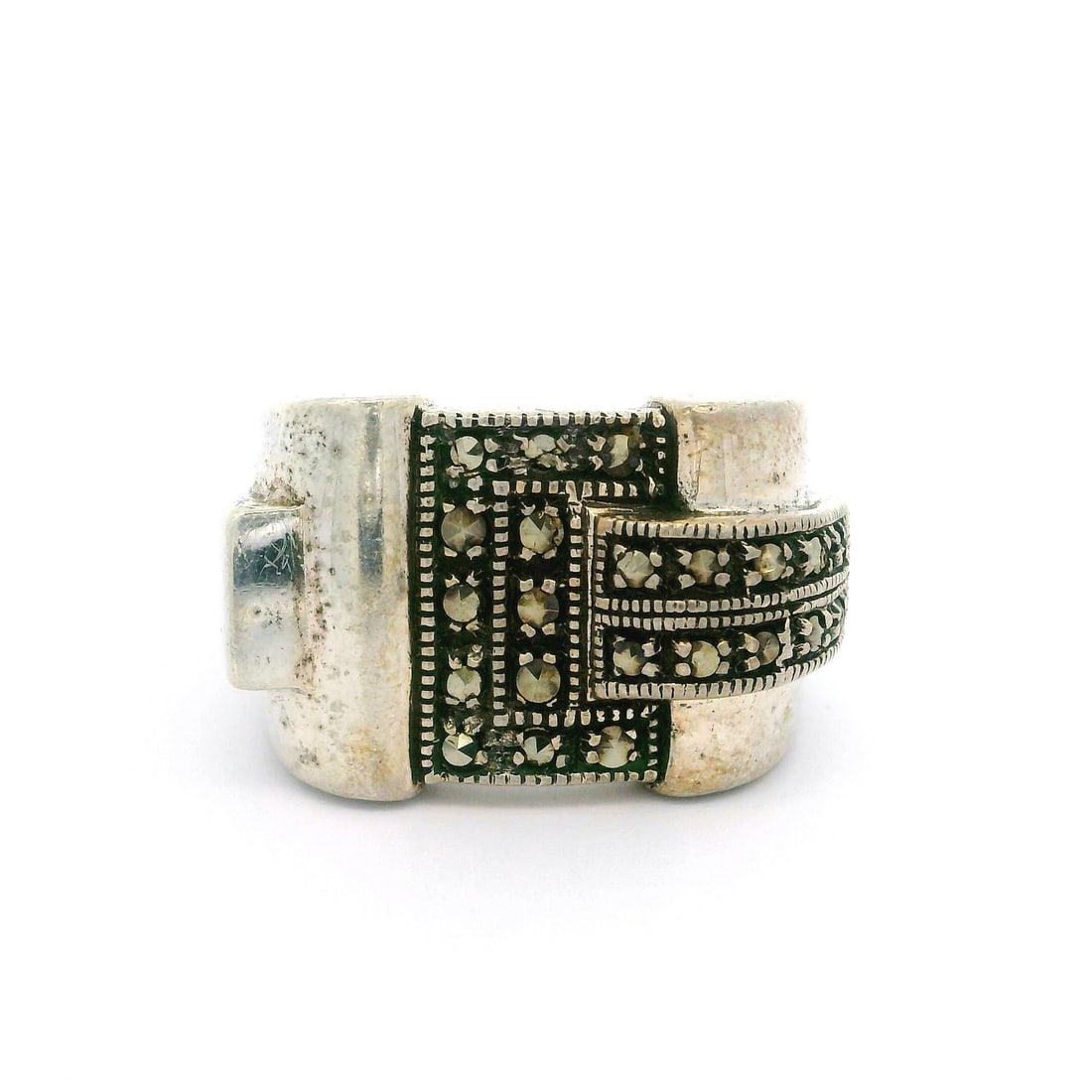 Vintage Sterling Silver Marcasite Wide Buckle Cocktail Ring: Vintage Sterling Silver Marcasite Wide Buckle Cocktail Ring This vintage cocktail band ring features a striking buckle style design crafted from high-quality sterling silver (.925). Adorned with numer