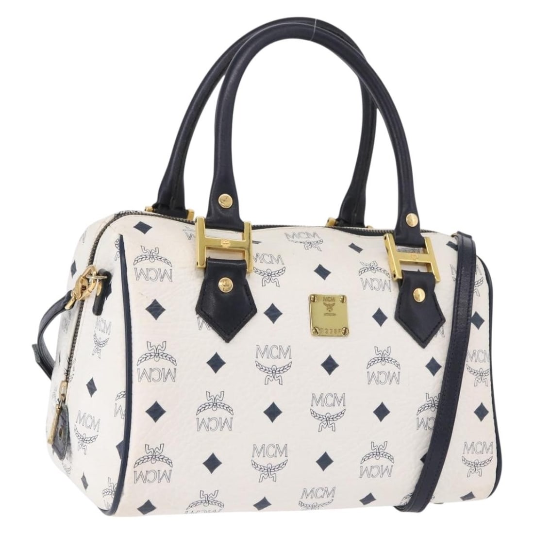 MCM Boston Bag White PVC Leather 2way Shoulder Strap 192878A: MCM Boston Bag White PVC Leather 2way Shoulder Strap 192878A MCM Boston bag in white with gold-tone accents, made from PVC leather. This 2-way bag includes a shoulder strap and was made in Germany. It