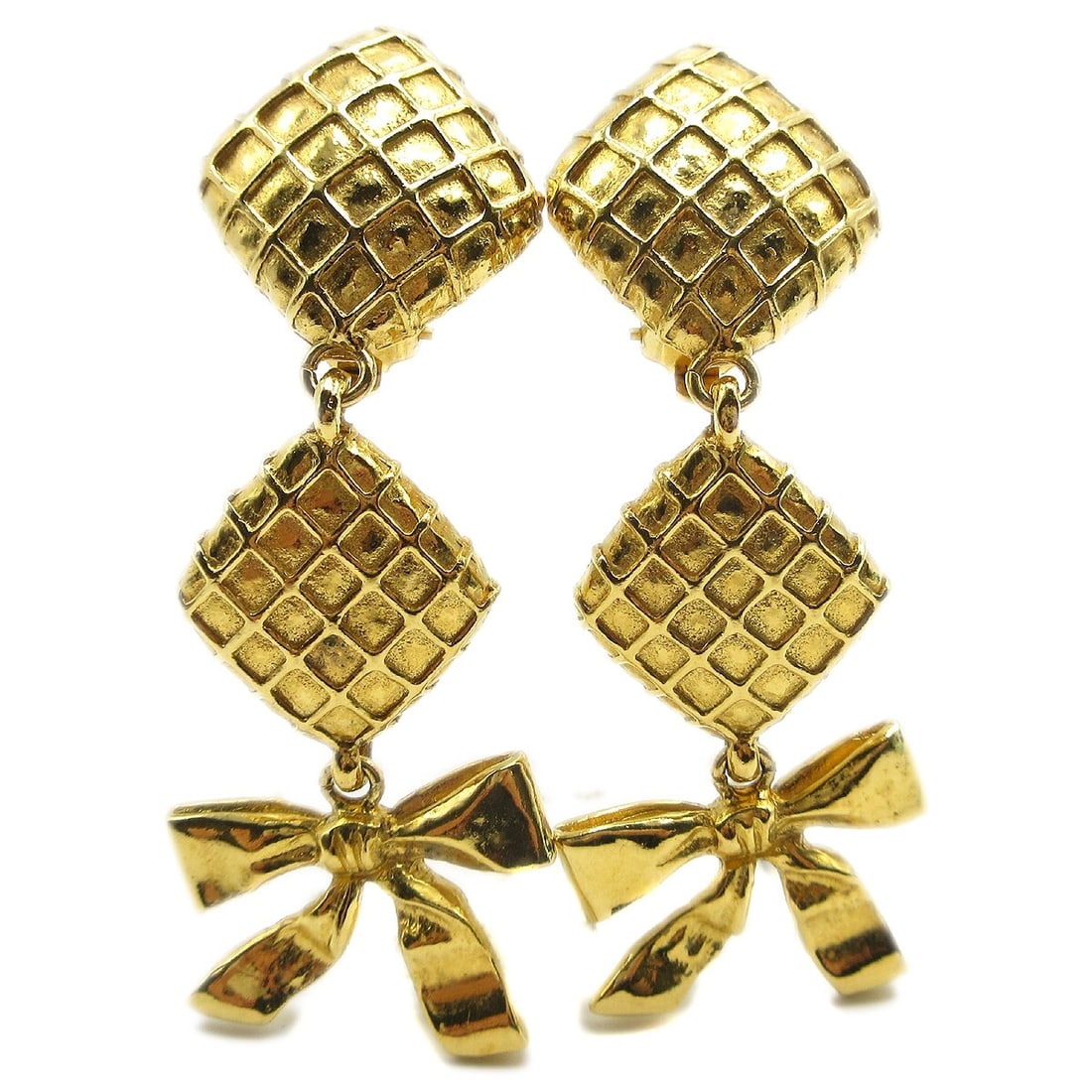 CHANEL CC Bow Motif Clip-On Dangle Earrings Gold Plated: CHANEL CC Bow Motif Clip-On Dangle Earrings Gold Plated Clip-on dangle earrings by Chanel featuring quilted CC logo bows in a gold-plated finish. Made in France, this pair presents in very good condit