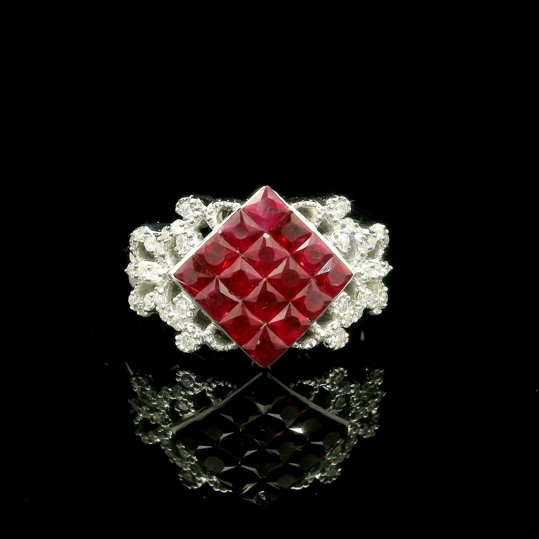18k White Gold Ruby Diamond Wide Band Cocktail Ring: 18k White Gold Ruby Diamond Wide Band Cocktail Ring This exquisite wide band ring features an invisible mystery set design showcasing 16 natural genuine rubies in a vivid deep red color, each approxim