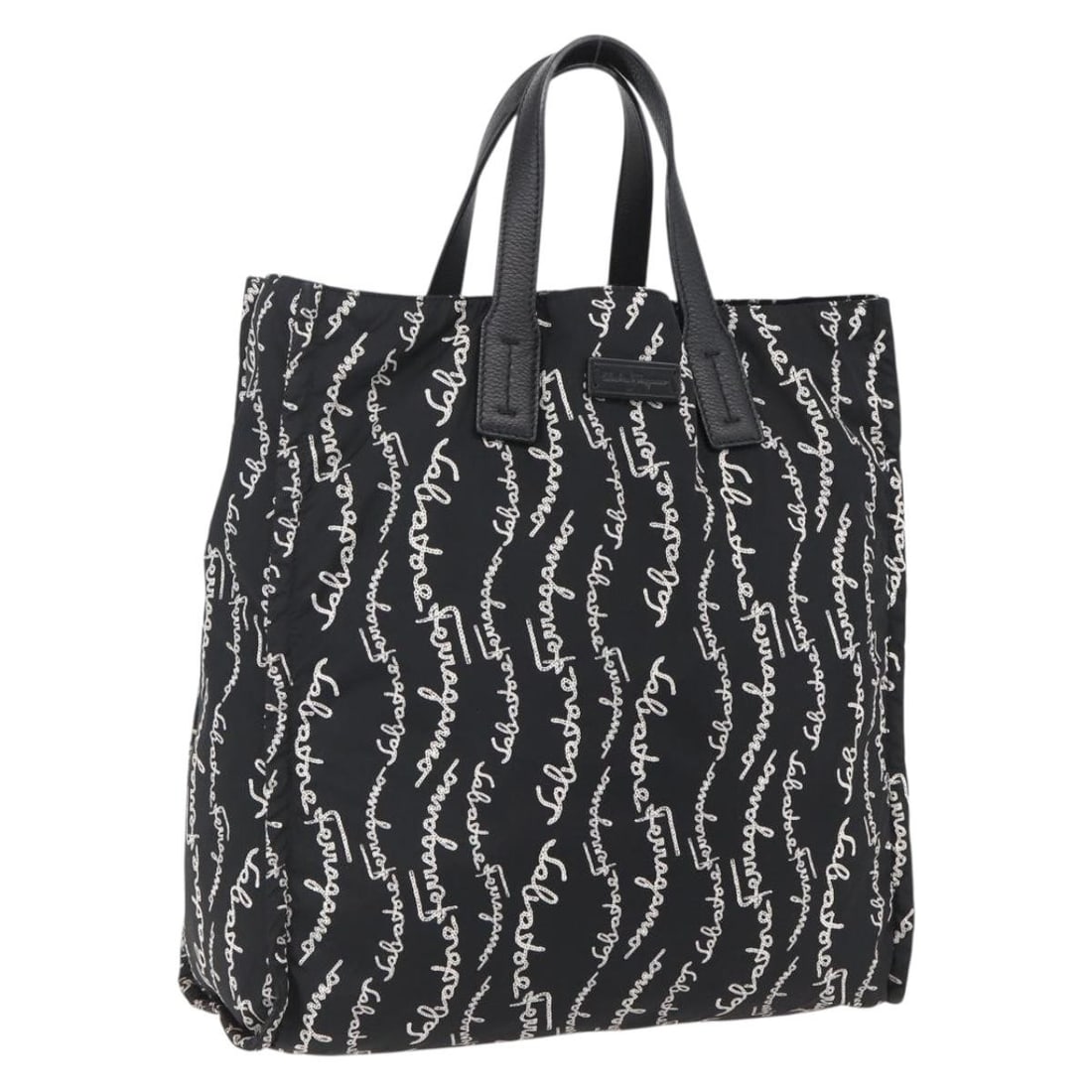 Black Nylon Tote Bag Salvatore Ferragamo Made in Italy: Black Nylon Tote Bag Salvatore Ferragamo Made in Italy Black nylon tote bag made in Italy. The bag measures approximately W35 cm x H35 cm x D12 cm, with a handle drop of approximately 13 cm. It is off