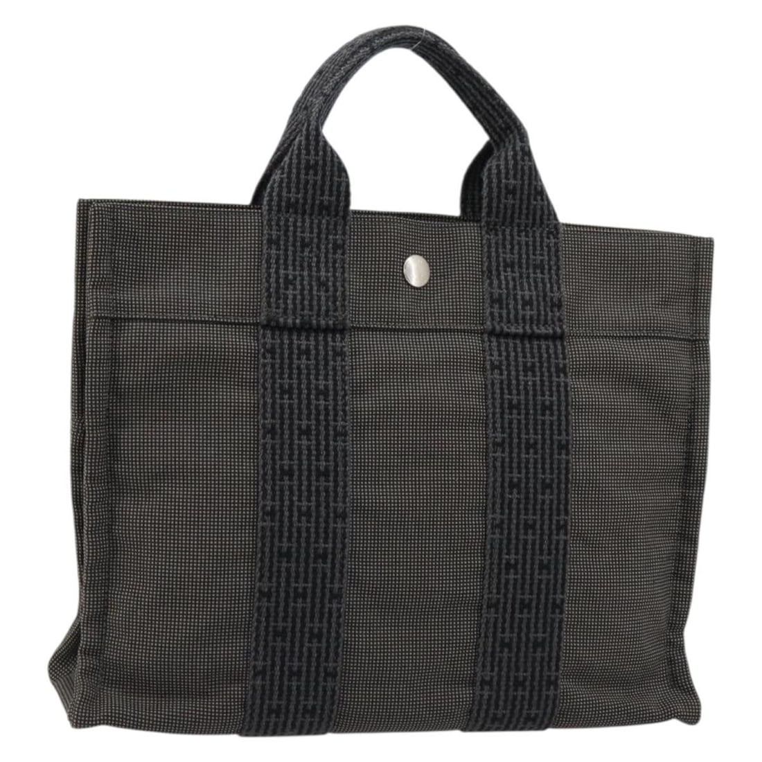 Hermes Her Line PM Gray Canvas Handbag Silver Tone Hardware: Hermes Her Line PM Gray Canvas Handbag Silver Tone Hardware Hermes Her Line PM hand bag in gray and silver canvas, made in France. The bag measures approximately 30 cm W x 24 cm H x 9 cm D, with an ap