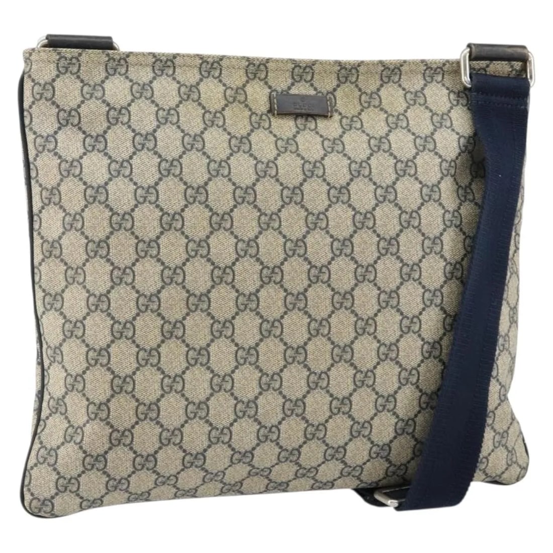 Navy GG Coated Canvas Gucci Unisex Messenger Bag with Zip Top: Navy GG Coated Canvas Gucci Unisex Messenger Bag with Zip Top This pre-owned Gucci Zip Top Messenger Bag is crafted from navy GG coated PVC canvas and designed for unisex use. It features a zip-top cl