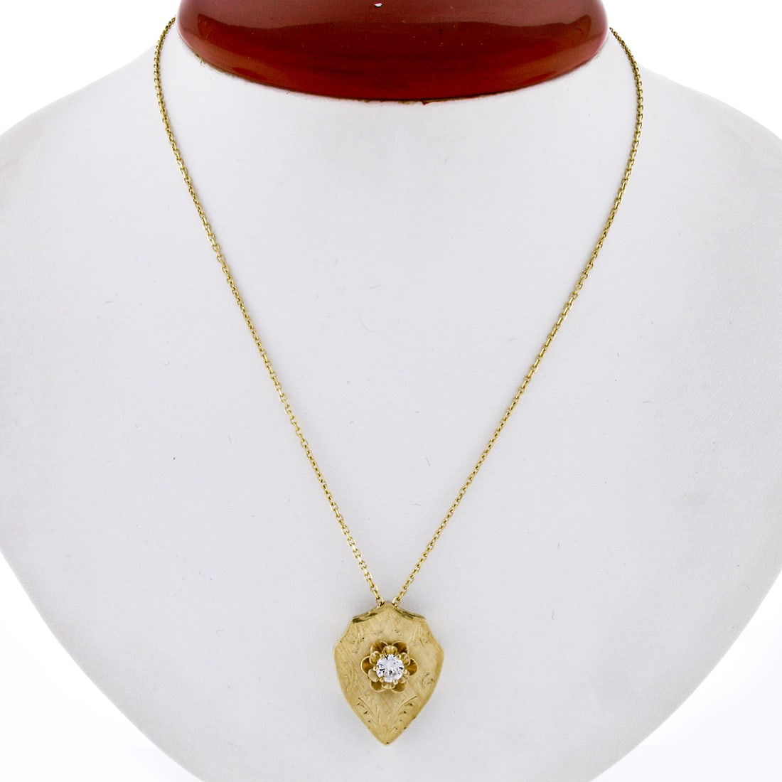 14k Yellow Gold Shield Pendant with 0.40ct Old Transitional Diamond: 14k Yellow Gold Shield Pendant with 0.40ct Old Transitional Diamond This vintage pendant features a hand-etched shield design crafted from solid 14k yellow gold. At its center is a natural old transit