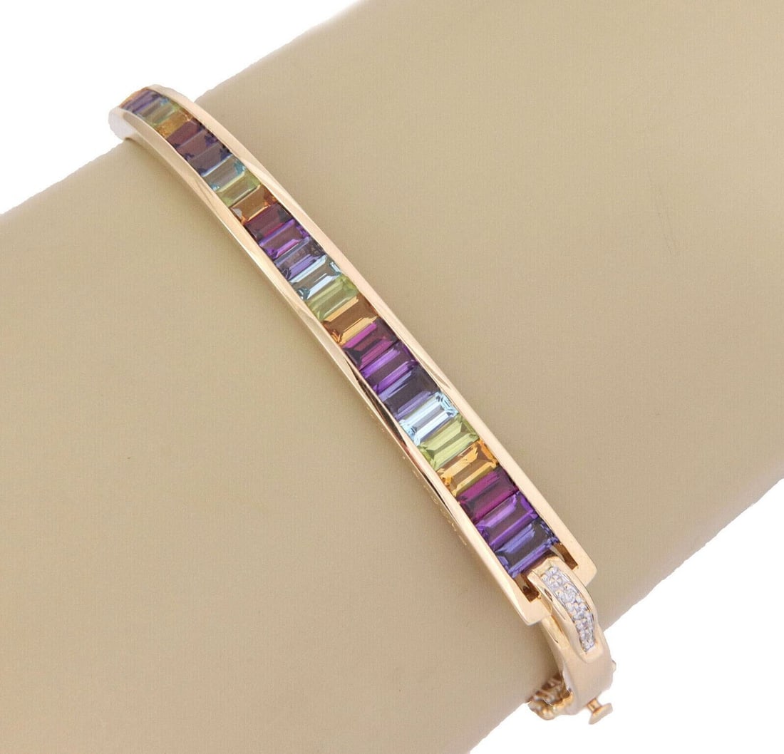 Guy Laroche 18k Yellow Gold Bangle Bracelet with Diamonds and Multicolor Gems: Guy Laroche 18k Yellow Gold Bangle Bracelet with Diamonds and Multicolor Gems A vintage-style Guy Laroche gemstone bangle bracelet crafted in 18k yellow gold. It features a slim sculptural, tapered fo