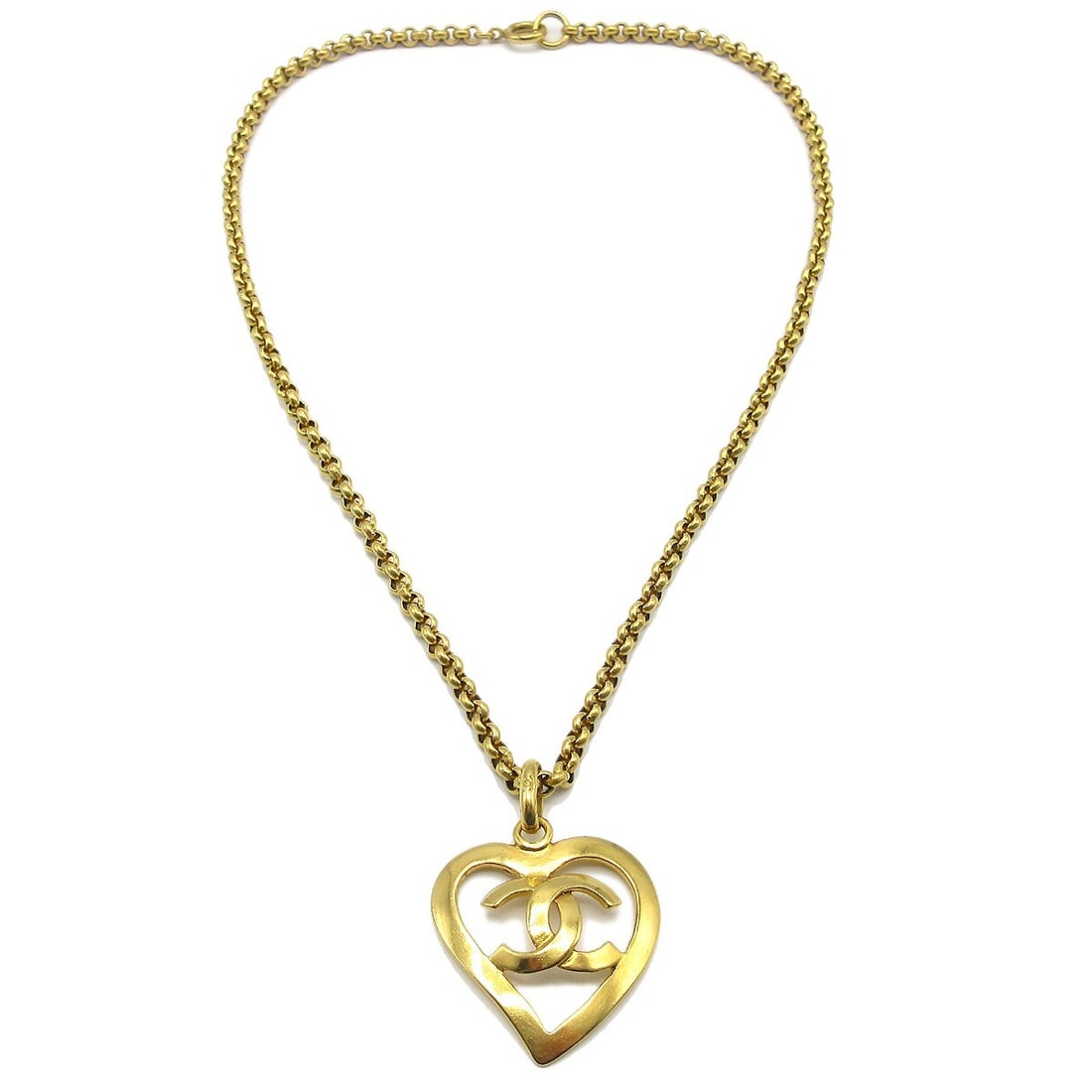 Vintage Chanel 95P Gold Plated Heart Pendant Necklace: Vintage Chanel 95P Gold Plated Heart Pendant Necklace Vintage Chanel pendant necklace with a heart-shaped charm and CC logo design. This gold-plated necklace is made in France and shows light scratchi