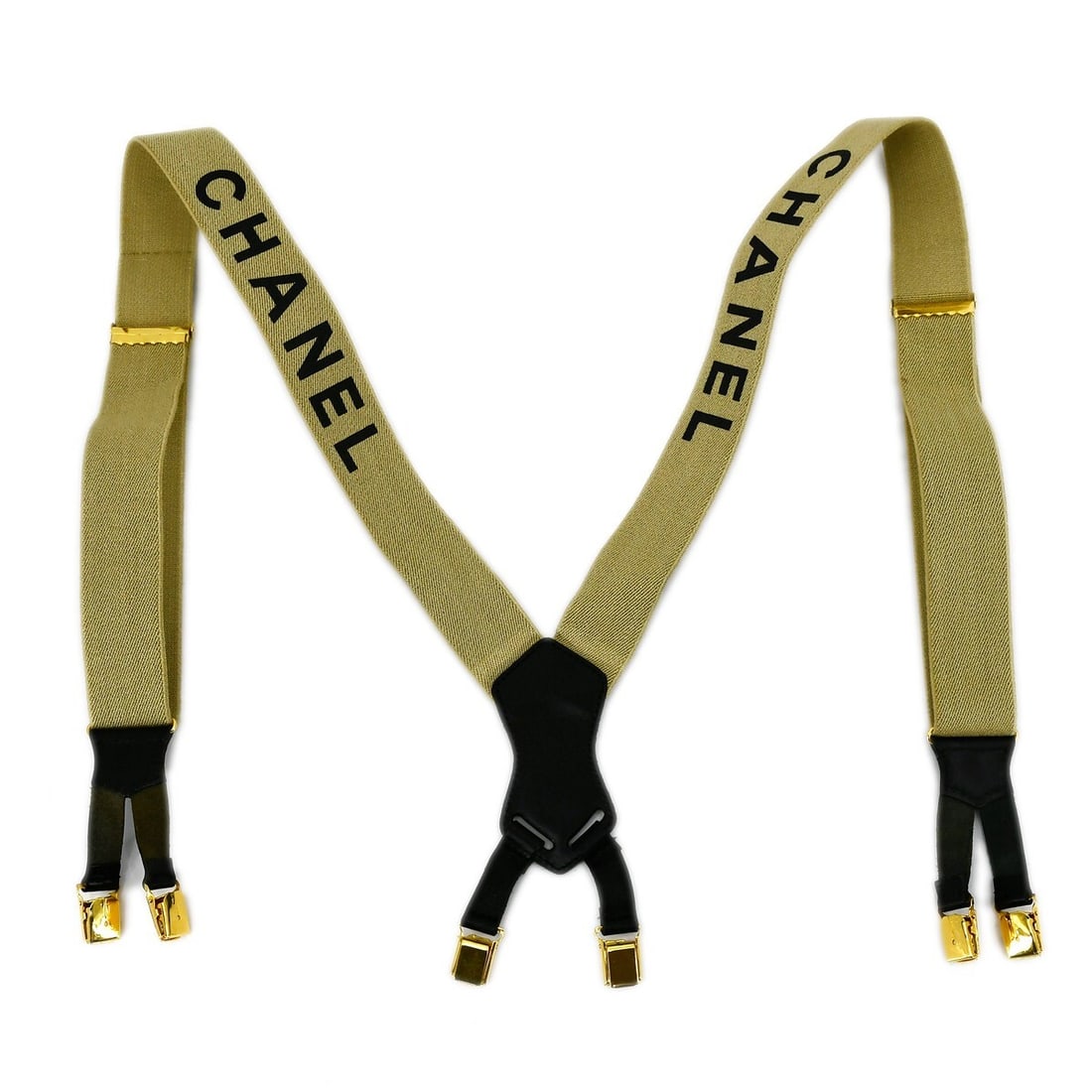 Chanel Beige Leather Suspenders with Gold Tone Hardware: Chanel Beige Leather Suspenders with Gold Tone Hardware Chanel suspenders for women in beige with leather trim and metal-themed detailing. This one-size pair is made in France and features an adjustab