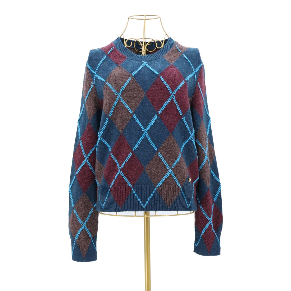 CHANEL LOOK35 Cashmere Elastane Knit Sweater Size 38 P77444K11172: CHANEL LOOK35 Cashmere Elastane Knit Sweater Size 38 P77444K11172 A CHANEL knitting sweater in a brown, red, and navy colorway with light accents. It is made from cashmere and elastane and is sized 38