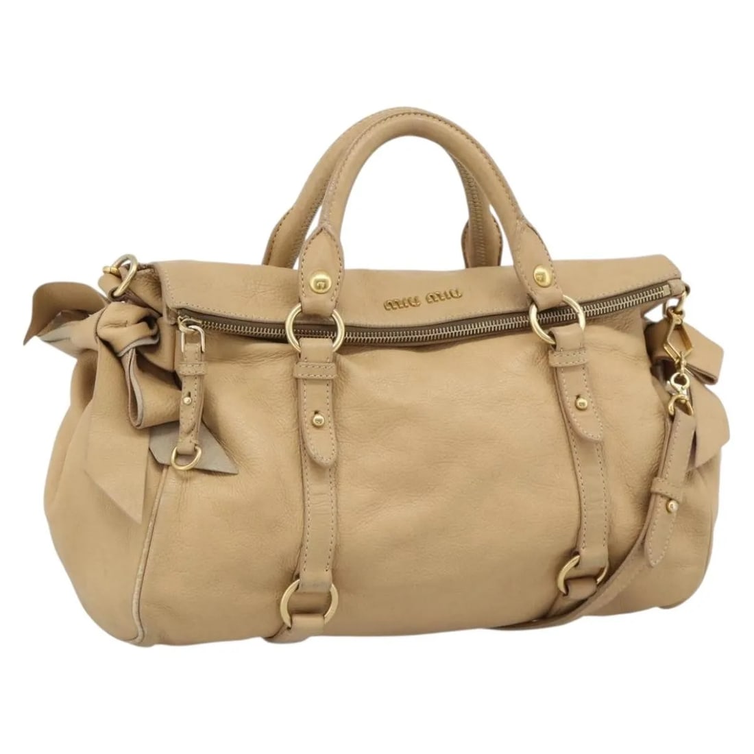 Miu Miu Convertible Satchel Beige Leather Handbag: Miu Miu Convertible Satchel Beige Leather Handbag A Miu Miu convertible satchel in beige leather with a unisex design. This pre-owned bag remains in good overall condition with visible wear consistent