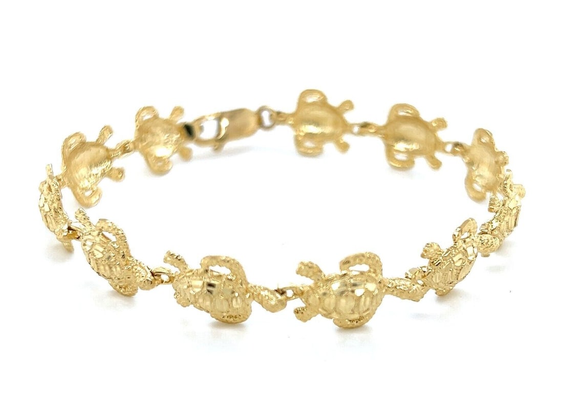 Vintage 14k Yellow Gold Turtle Link Bracelet 7.25 Inch: Vintage 14k Yellow Gold Turtle Link Bracelet 7.25 Inch This vintage estate turtle charm link bracelet is crafted in solid 14k yellow gold and features an all-around turtle link construction with a pol