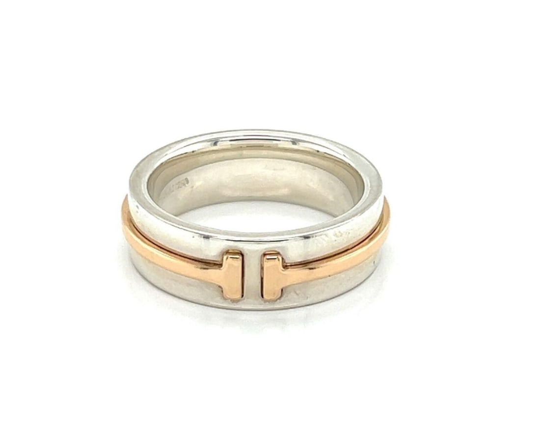 Tiffany & Co. T Two Narrow Band Ring Sterling Silver 18k Rose Gold 4.5: Tiffany & Co. T Two Narrow Band Ring Sterling Silver 18k Rose Gold 4.5 A Tiffany & Co. T Two narrow band ring crafted in sterling silver and 18k rose gold. The design features the collection's iconic 