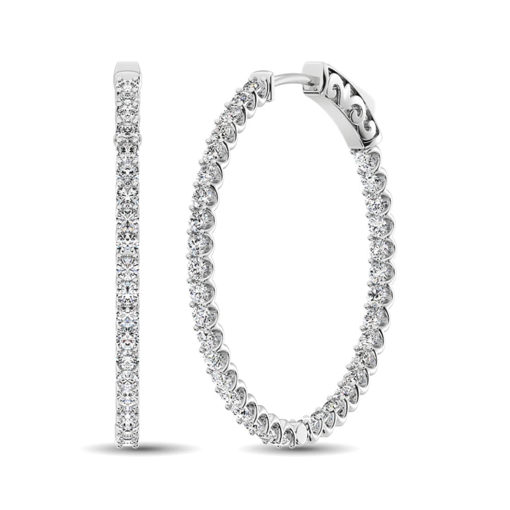 14K White Gold Diamond 1 1/2 Ct.Tw. In and Out Hoop Earrings: 14K White Gold Diamond 1 1/2 Ct.Tw. In and Out Hoop Earrings These glamorous earrings are available in 14K White Gold. There are 35 round diamonds with a total carat weight of 1 1/2 Ct.Tw. set in a Pr
