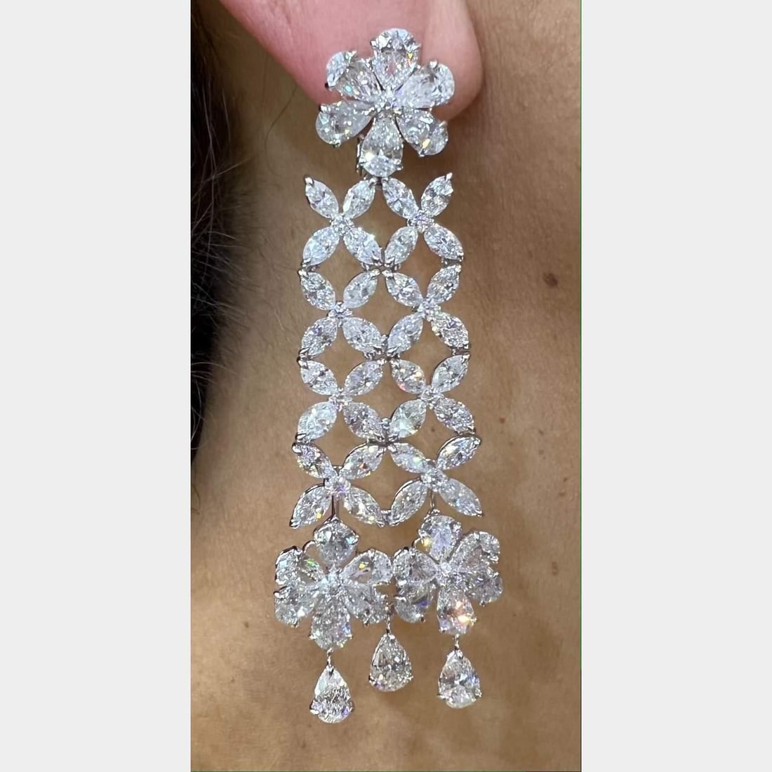 Stunning Platinum 37.34 Ct Diamond Chandelier Earrings: Stunning Platinum 37.34 Ct Diamond Chandelier Earrings Elegantly designed Platinum Diamond Chandelier Earrings featuring a stunning total diamond weight of 37.34 Ct. These earrings are adorned with 10