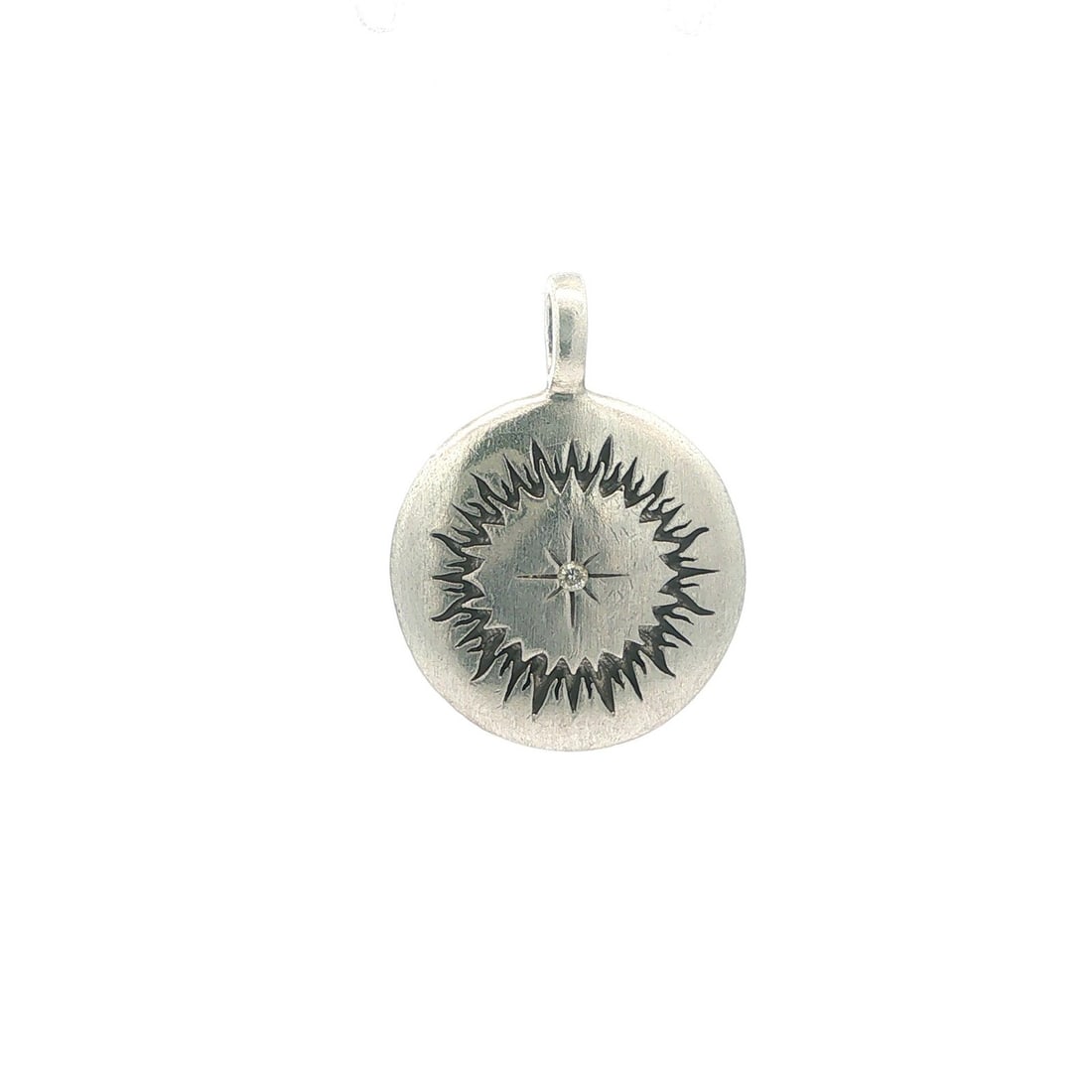 Sterling silver star pendant with 1 diamond La Soula Creation: Sterling silver star pendant with 1 diamond La Soula Creation This pendant features a star sunray design crafted from sterling silver and set with a single natural round brilliant cut diamond in a sta