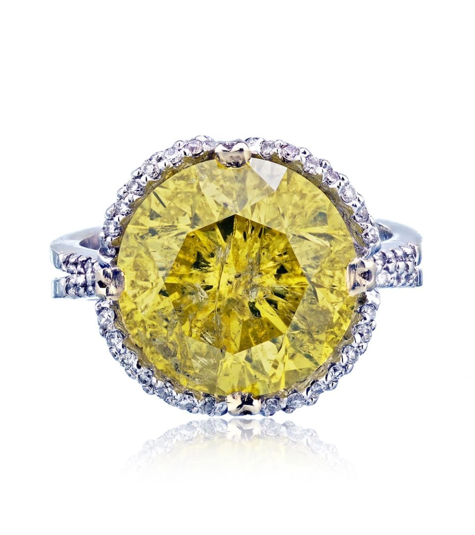 18K White Gold 7.58CT Treated Yellow Diamond Engagement Ring: 18K White Gold 7.58CT Treated Yellow Diamond Engagement Ring This exquisite ring features a stunning 7.58-carat round diamond with a treated yellow hue, set in luxurious 18K white gold. Weighing 5.3 g