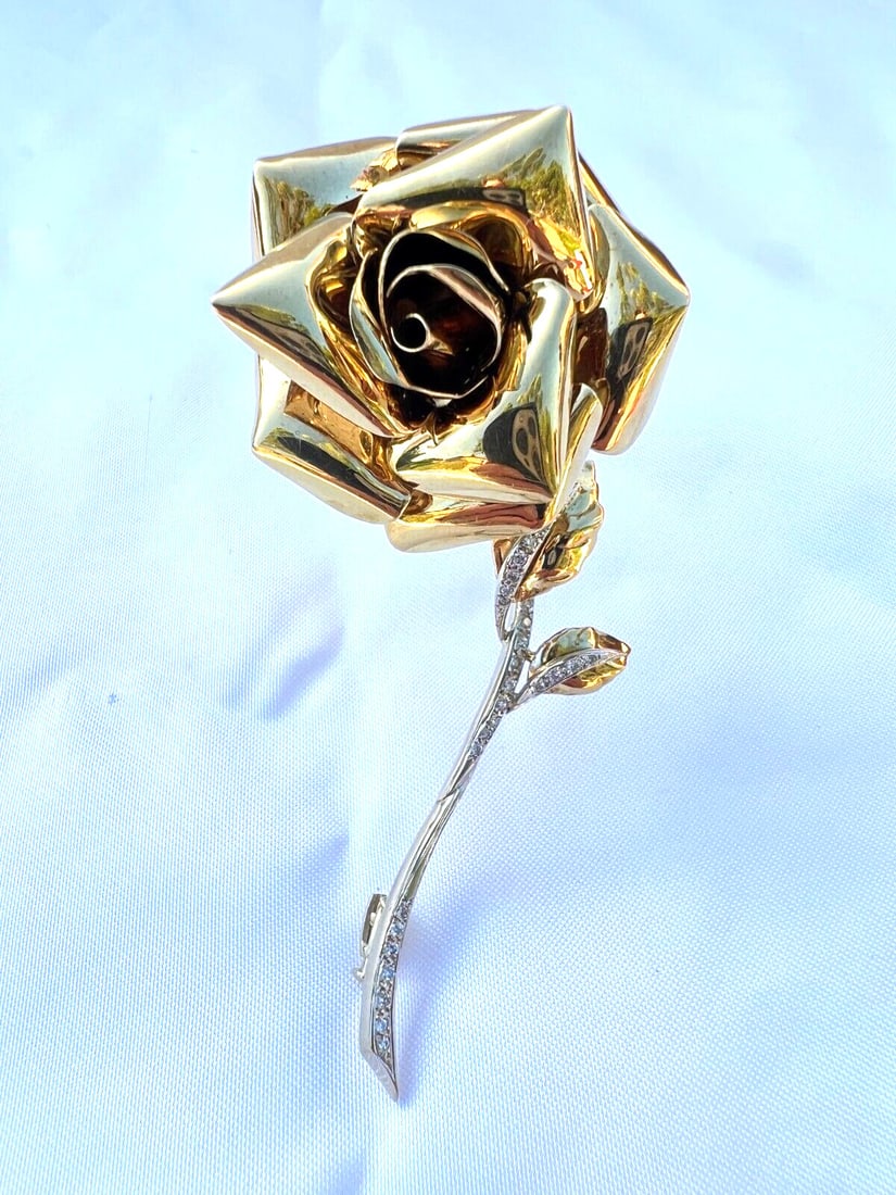French 18K Gold Diamond Rose Brooch Signed Hallmarked: French 18K Gold Diamond Rose Brooch Signed Hallmarked Discover the elegance of this magnificent French brooch crafted from 18K yellow gold in the shape of a rose. This stunning piece showcases intrica