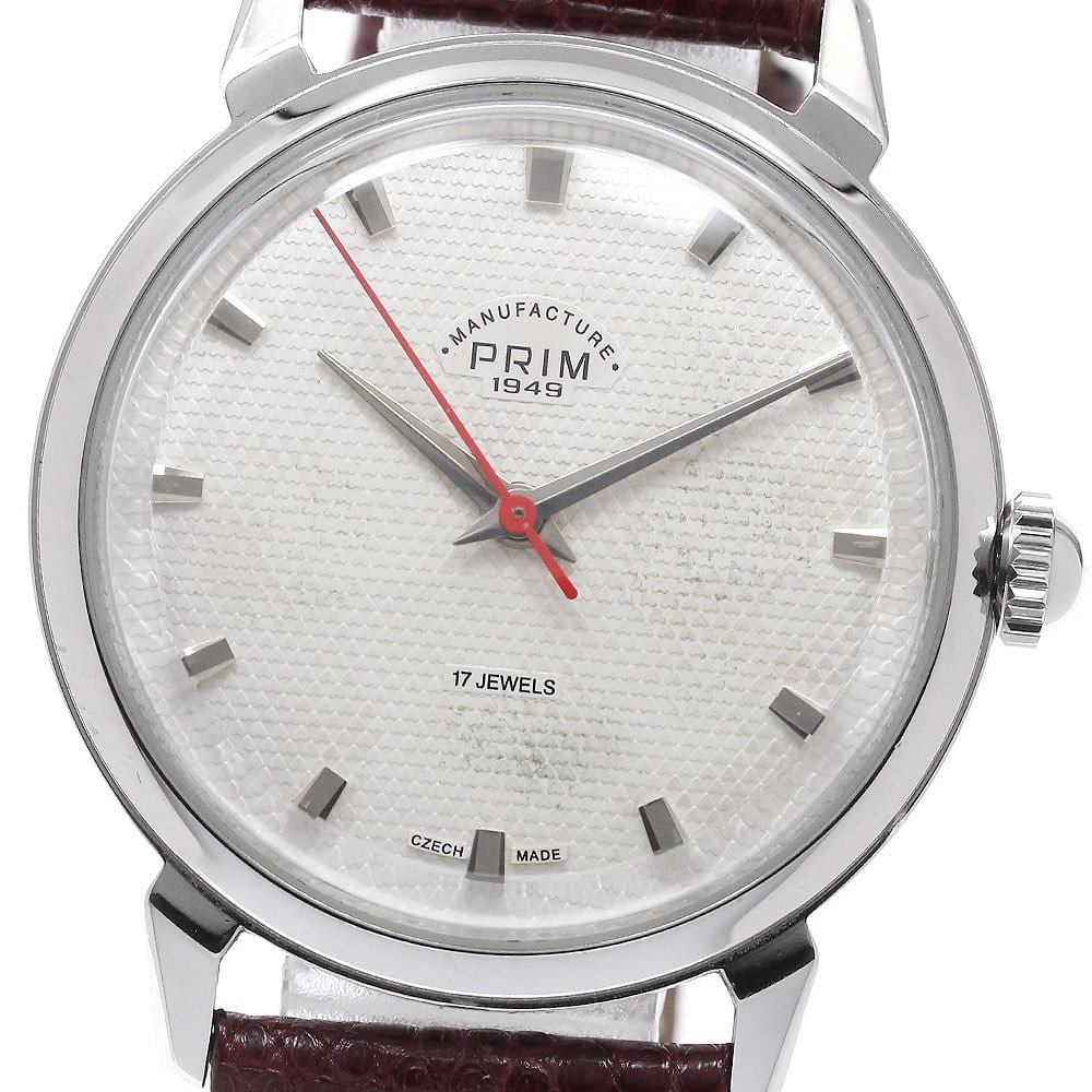 PURIM Pavuk PR.PVH.34.WH Hand Wound Wristwatch Unisex: PURIM Pavuk PR.PVH.34.WH Hand Wound Wristwatch Unisex PURIM Pavuk hand-wound wristwatch with a stainless steel case, leather belt, and silver dial. This pre-owned watch is in used condition with noted