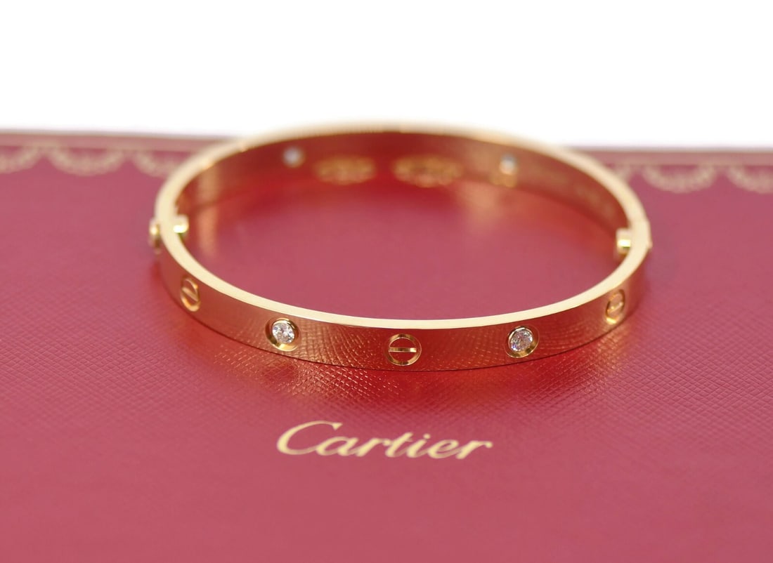 Cartier 4 Diamond 18K Yellow Gold Love Bangle Bracelet Size 17 Authentic: Cartier 4 Diamond 18K Yellow Gold Love Bangle Bracelet Size 17 Authentic This exquisite Cartier Love Bracelet features four dazzling diamonds set in luxurious 18K yellow gold. Designed as a bangle, it