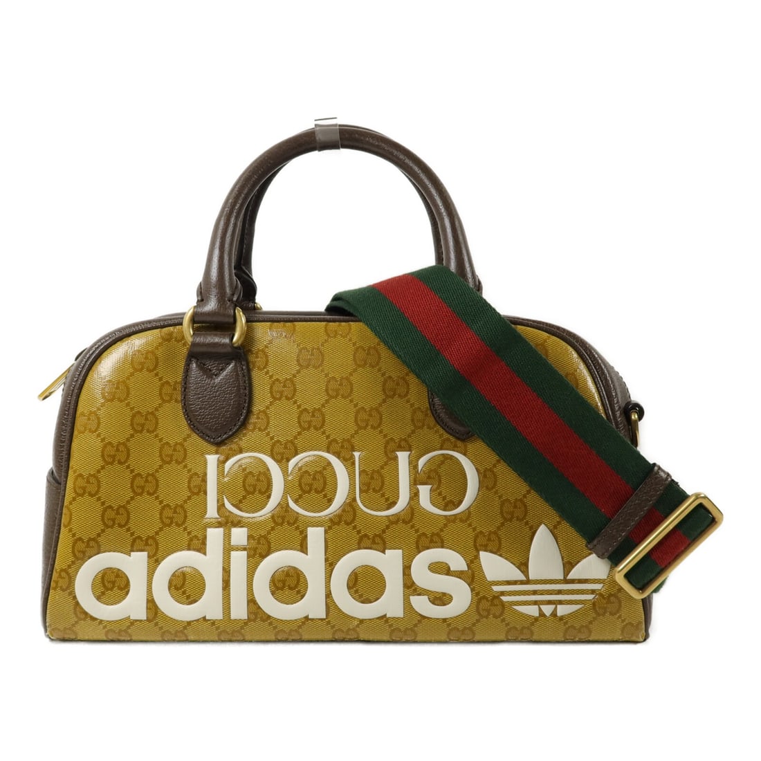 Gucci x Adidas 702397 2way shoulder bag GG coated canvas brown beige: Gucci x Adidas 702397 2way shoulder bag GG coated canvas brown beige Gucci x Adidas 2way shoulder bag in brown and beige coated canvas. It features a PVC coated canvas construction, a handle, and an a