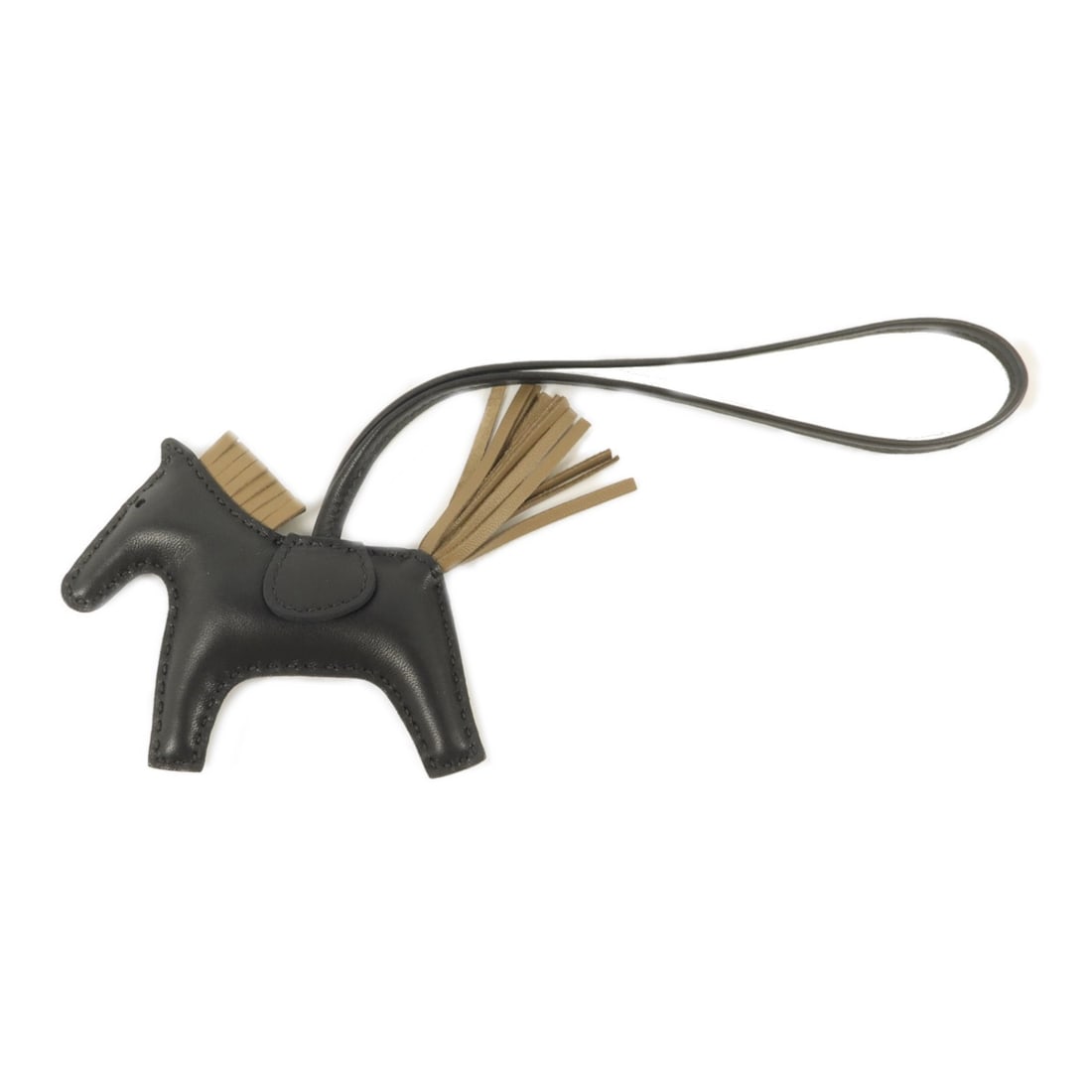 Hermes PM Rodeo bag charm in Milo lambskin Noir with box: Hermes PM Rodeo bag charm in Milo lambskin Noir with box Hermes Rodeo PM charm in Milo leather, presented in Noir Black and Brown. The item is identified as model no. W/89 and includes a storage box. 