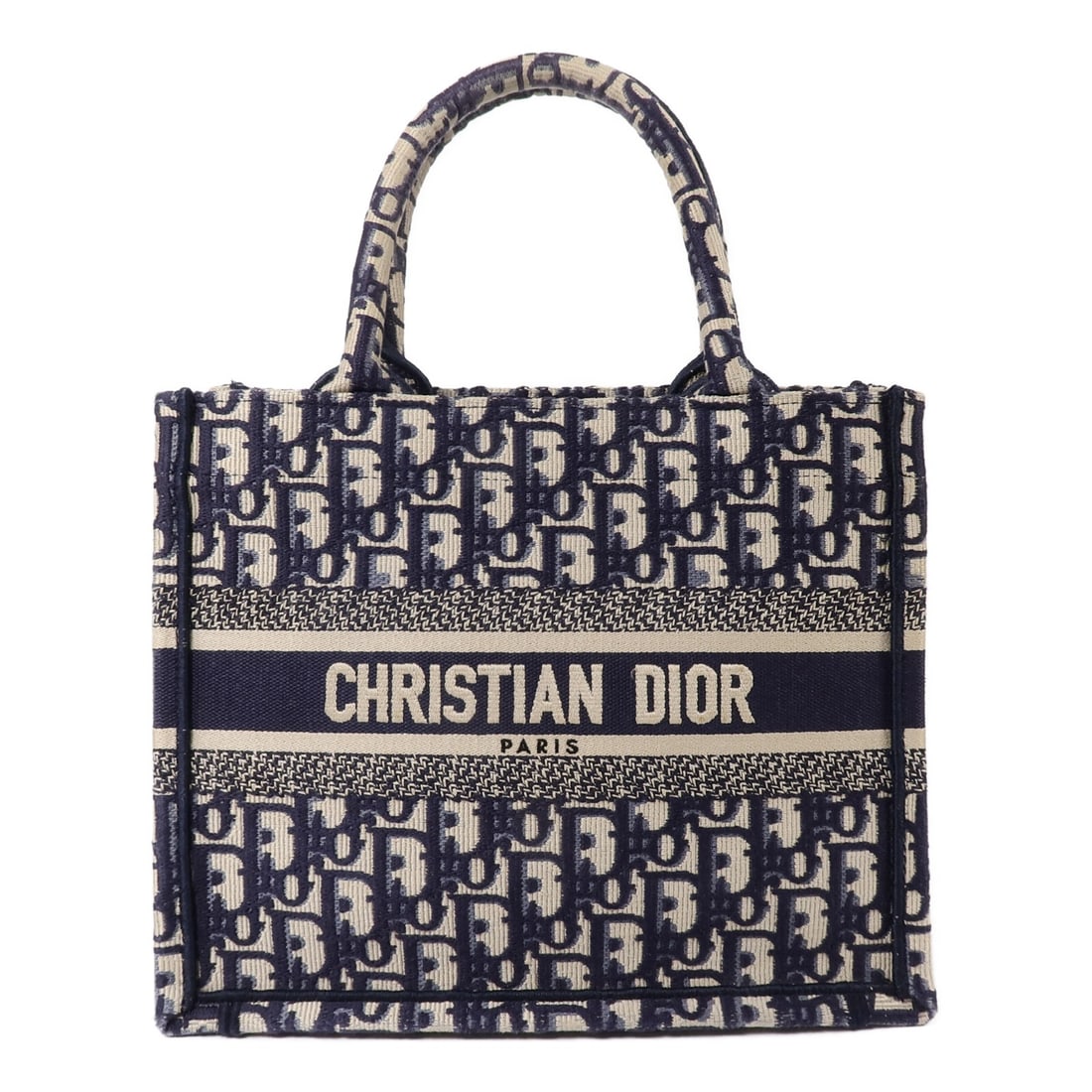 Dior Book Tote Small Blue Oblique Canvas Handbag: Dior Book Tote Small Blue Oblique Canvas Handbag A Christian Dior CD Canvas Book Tote Small Tote Bag in blue, made from canvas with Oblique detailing. It comes with storage bags and shows reasonable w