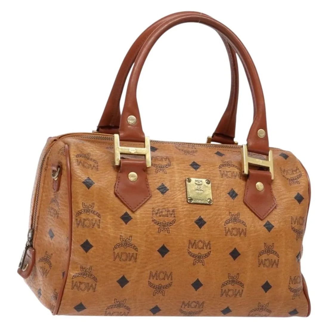 MCM Visetos Logogramme Brown PVC Leather Handbag Germany: MCM Visetos Logogramme Brown PVC Leather Handbag Germany This MCM Visetos logogramme handbag features a brown PVC exterior with leather accents. Designed for women, it offers a spacious interior and i