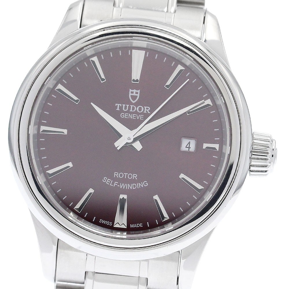 TUDOR Style 12100 Womens Automatic Date Watch Stainless Steel: TUDOR Style 12100 Womens Automatic Date Watch Stainless Steel This Tudor Style Date ladies wristwatch features a stainless steel case and bracelet with a Bordeaux-colored dial. The watch is powered by