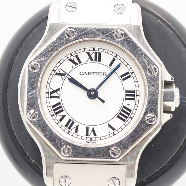 Cartier Santos Octagon ladies wristwatch with white dial vintage: Cartier Santos Octagon ladies wristwatch with white dial vintage Vintage Cartier Santos Octagon ladies wristwatch with a white dial. The watch is described as deadstock and mint, and it is a pre-owned