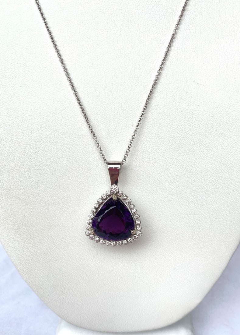 Dyach 18K White Gold Diamond Amethyst Pendant Necklace 18ct: Dyach 18K White Gold Diamond Amethyst Pendant Necklace 18ct This exquisite 18K white gold necklace features a stunning pendant crafted with a vibrant purple amethyst at its center, weighing 18 ct. Sur