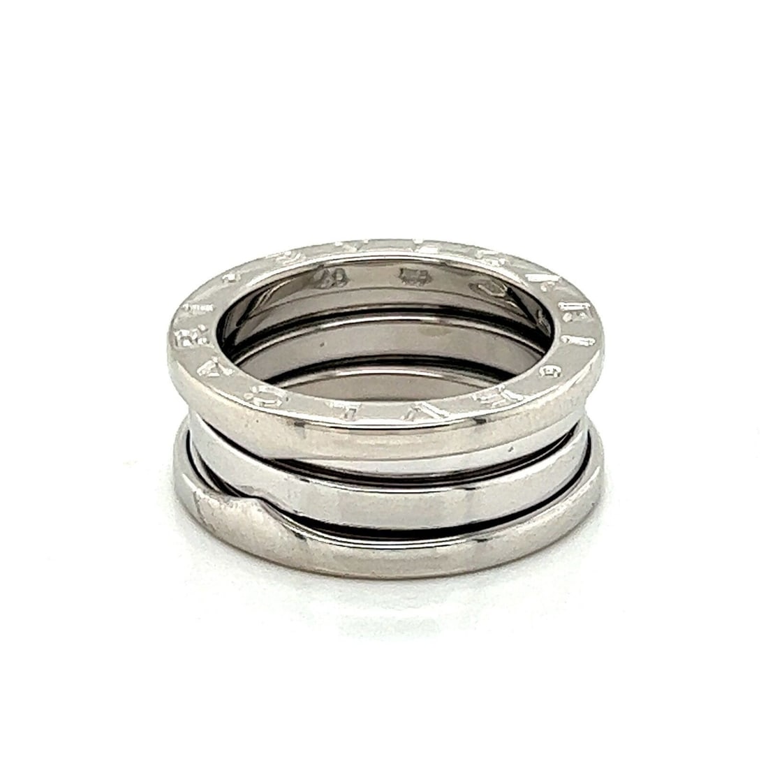 Bvlgari B.zero1 18k White Gold Three Band Ring US 5 EU 49: Bvlgari B.zero1 18k White Gold Three Band Ring US 5 EU 49 This Bvlgari B.zero1 three-band ring is crafted in 18k white gold and features the collection's iconic spiral-inspired design with engraved BV