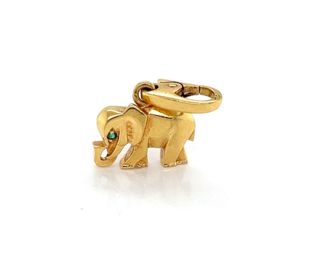 Cartier Elephant Charm Pendant 18k Yellow Gold with Emerald Accent: Cartier Elephant Charm Pendant 18k Yellow Gold with Emerald Accent A sculptural Cartier elephant charm pendant crafted in 18k yellow gold and accented with one natural emerald. The pendant is presente