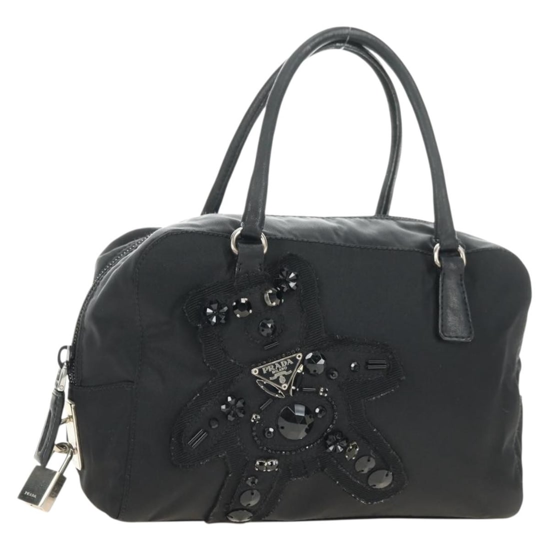Black Nylon Prada Handbag with Silver Tone Hardware Made in Italy: Black Nylon Prada Handbag with Silver Tone Hardware Made in Italy Black Prada nylon hand bag with silver-tone hardware, made in Italy. It measures approximately W21 x H14 x D7 cm with a handle drop of