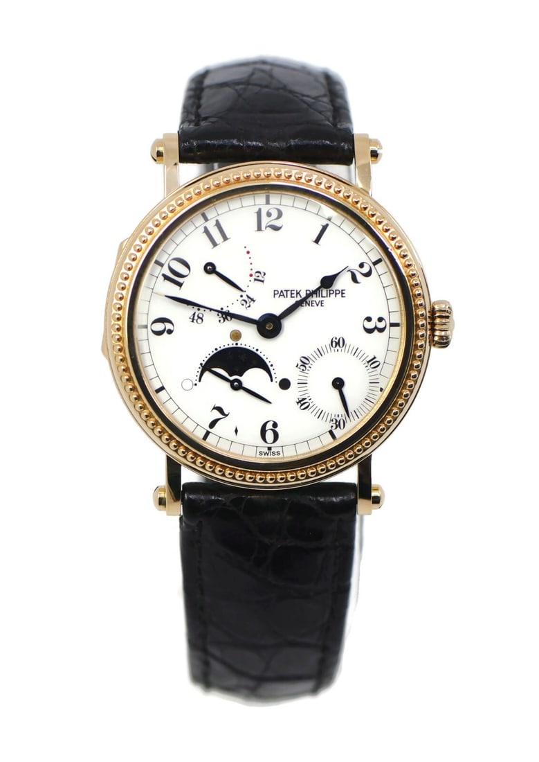 Patek Philippe 18K Yellow Gold Complication Watch Ref 5015J: Patek Philippe 18K Yellow Gold Complication Watch Ref 5015J This exquisite Patek Philippe Complication wristwatch showcases a timeless elegance with its 18K yellow gold case and classic design. The wa