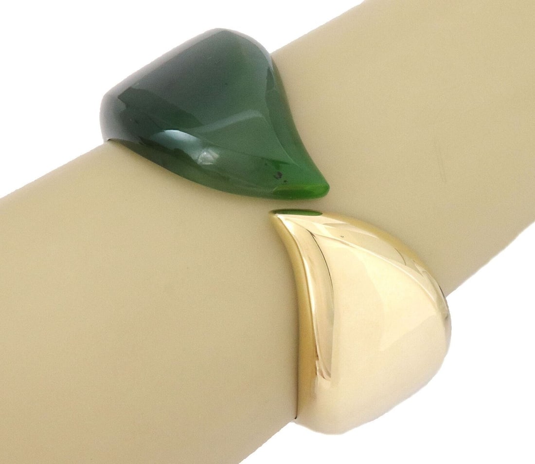 Tiffany Co Elsa Peretti Feather Cuff Bracelet 18k Gold Nephrite Jade: Tiffany Co Elsa Peretti Feather Cuff Bracelet 18k Gold Nephrite Jade This Tiffany & Co. Elsa Peretti Feather Cuff Bangle Bracelet features a sculptural feather-inspired open cuff design in 18k yellow 