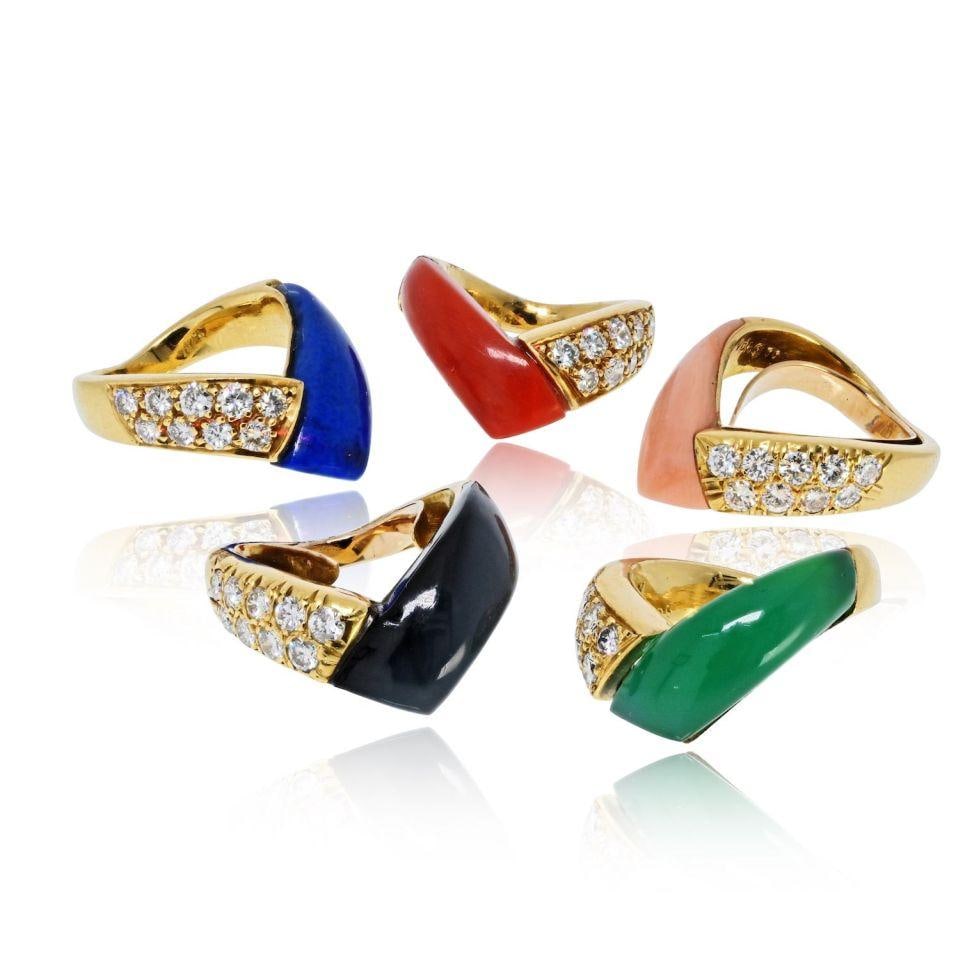 Five-Band 18K Yellow Gold Multicolor Gem Ring by Van Cleef & Arpels: Five-Band 18K Yellow Gold Multicolor Gem Ring by Van Cleef & Arpels This estate ring set by Van Cleef & Arpels features five sculptural bands crafted in 18K yellow gold. Each band showcases a unique c