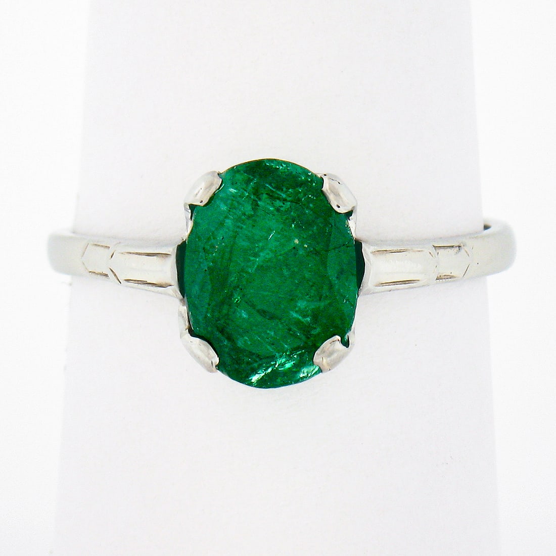 Antique 14k White Gold 1.64ct Emerald Oval Solitaire Ring: Antique 14k White Gold 1.64ct Emerald Oval Solitaire Ring This exquisite antique ring is crafted from solid 14k white gold and features a stunning natural emerald at its center. The oval cut emerald, 