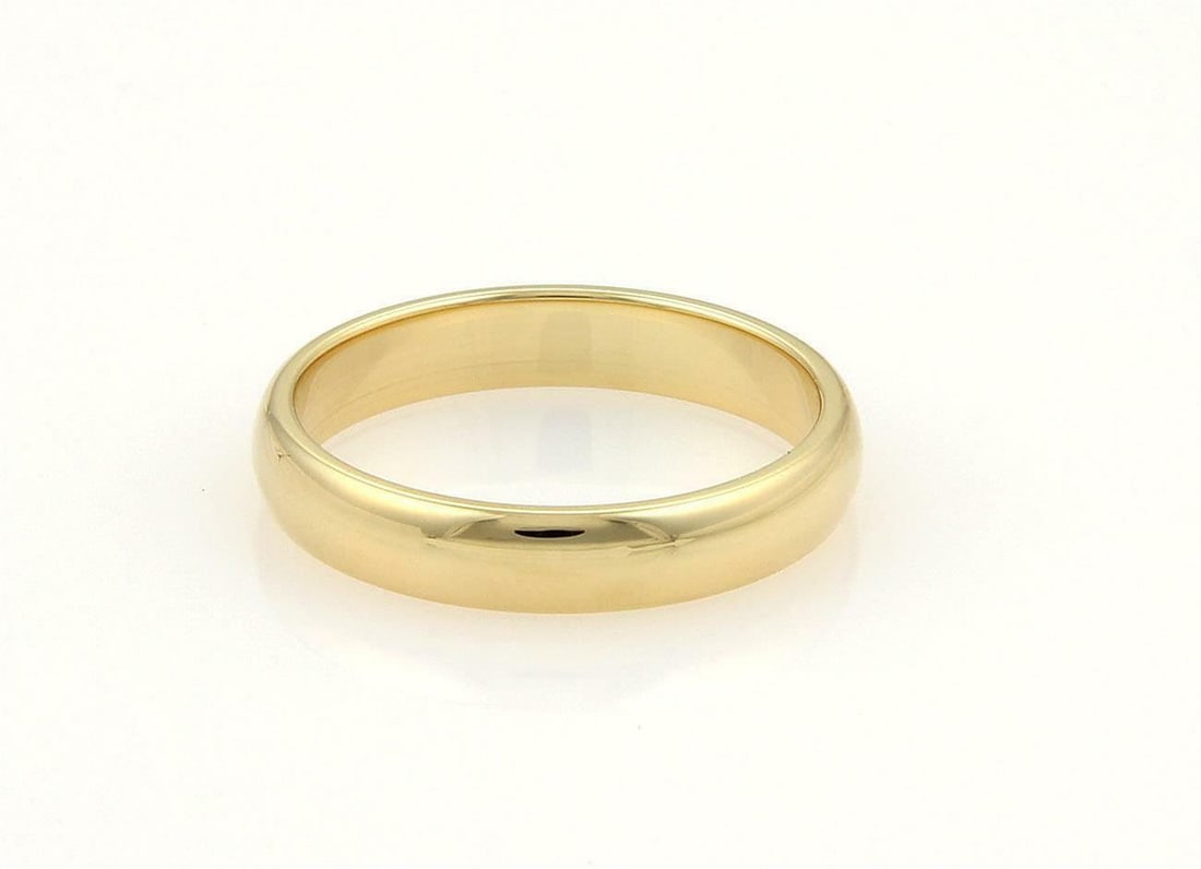 Tiffany & Co. 18k Yellow Gold 4mm Domed Men's Wedding Band: Tiffany & Co. 18k Yellow Gold 4mm Domed Men's Wedding Band This authentic men's wedding band from Tiffany & Co. exudes simple elegance. Crafted from high-quality 18k yellow gold, the ring features a p