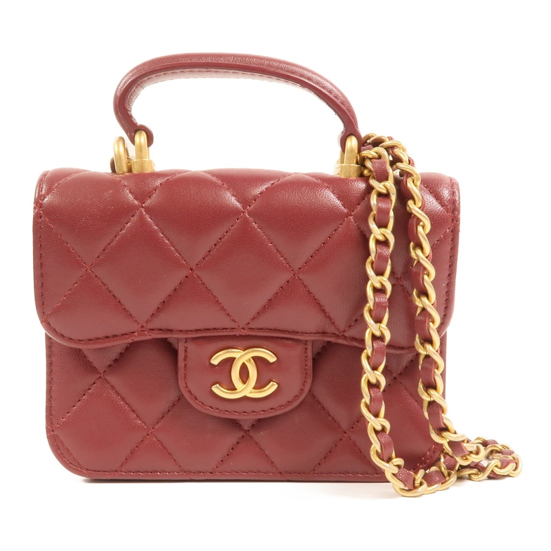 CHANEL CC lambskin flap shoulder bag with top handle red: CHANEL CC lambskin flap shoulder bag with top handle red A CHANEL CC top handle flap 2-way chain shoulder bag in red lambskin leather. It features a hook button closure, a top handle, and a chain shou