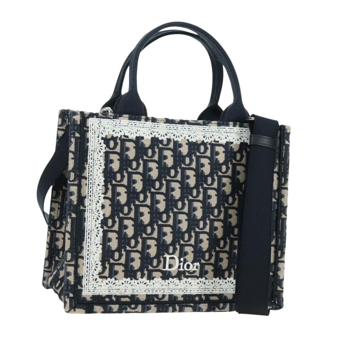 Christian Dior Oblique Trotter Canvas 2way Handbag Navy: Christian Dior Oblique Trotter Canvas 2way Handbag Navy Christian Dior 2-way handbag in navy and silver Trotter canvas, made in Italy. It comes with a dust bag, item box, and shoulder strap. The bag i