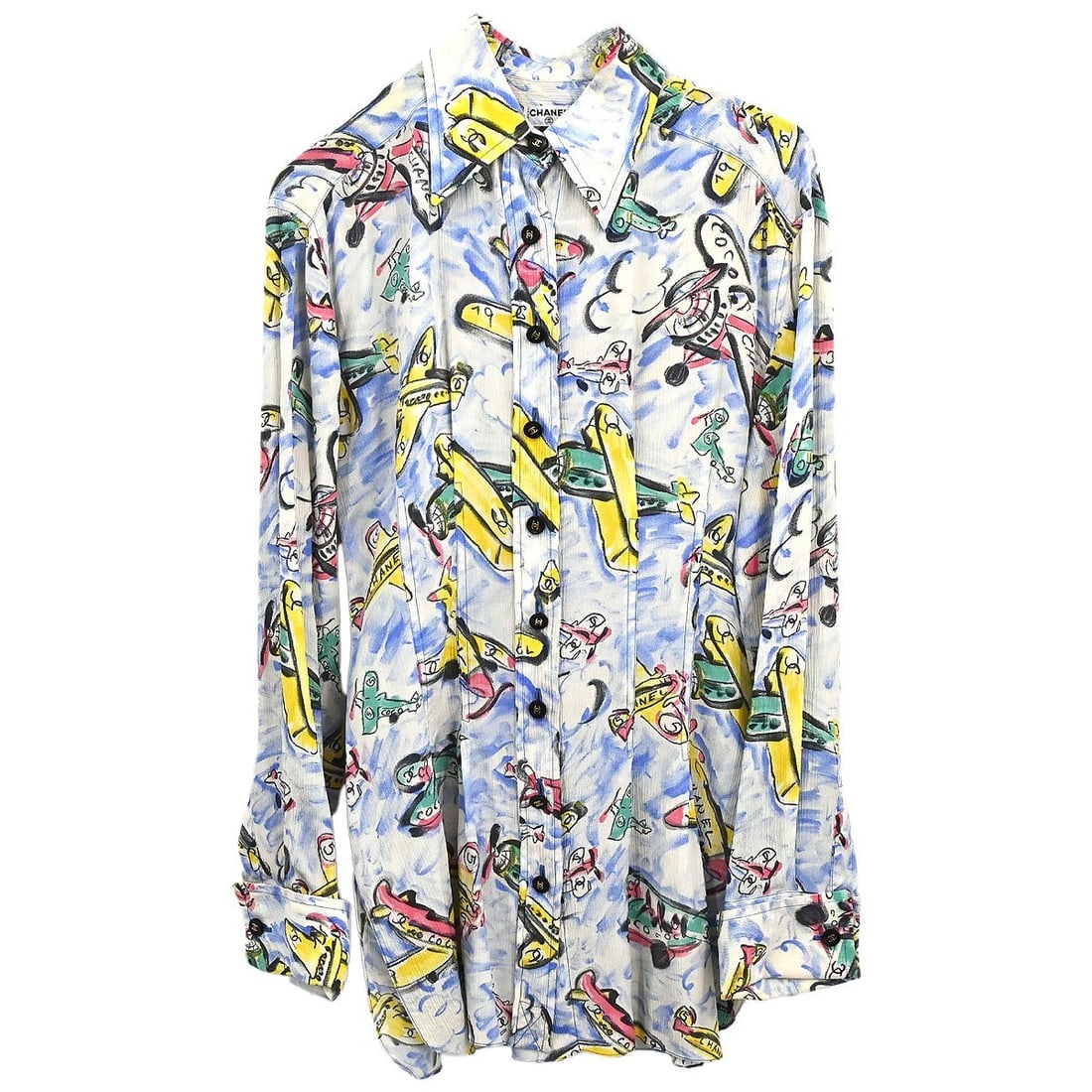 Chanel blue long sleeve blouse shirt: Chanel blue long sleeve blouse shirt Blue Chanel long sleeve blouse shirt with an airplane motif. The item is in great condition overall, with thread fraying at the armpit and a missing tag. It is off